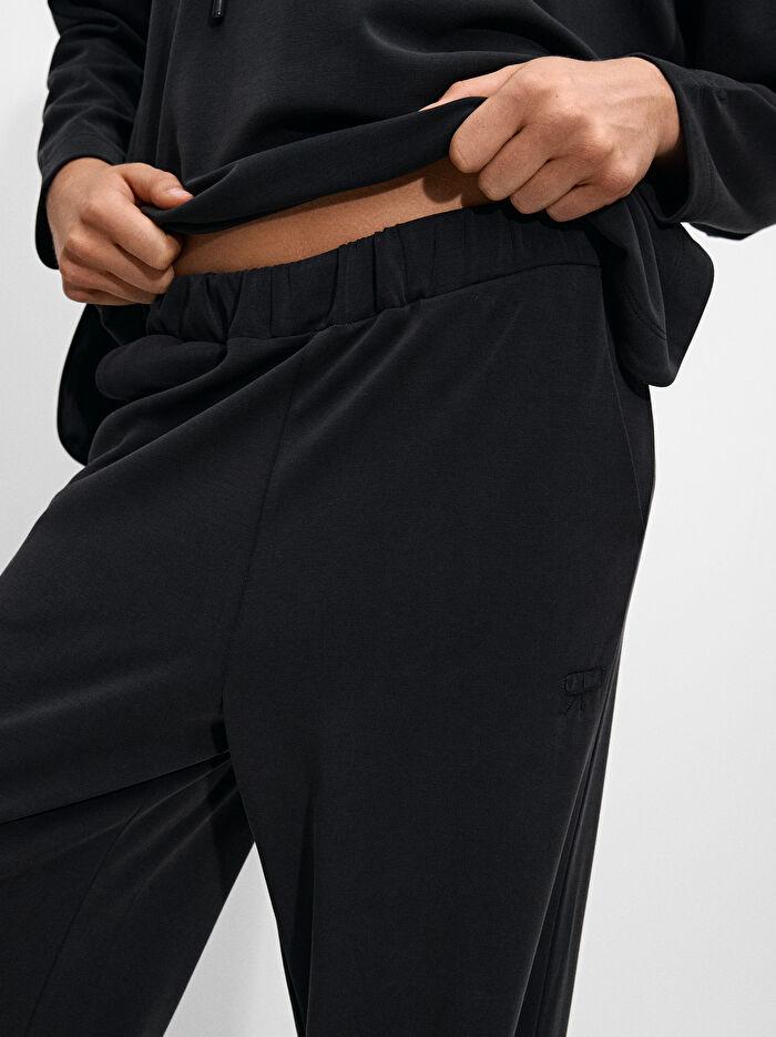 Elastik Bel Bantlı Bol Paça Pantolon